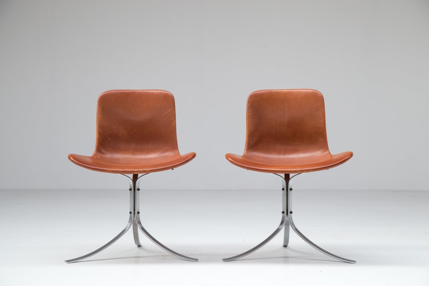 Pair of PK9 chairs by Poul Kjaerholm