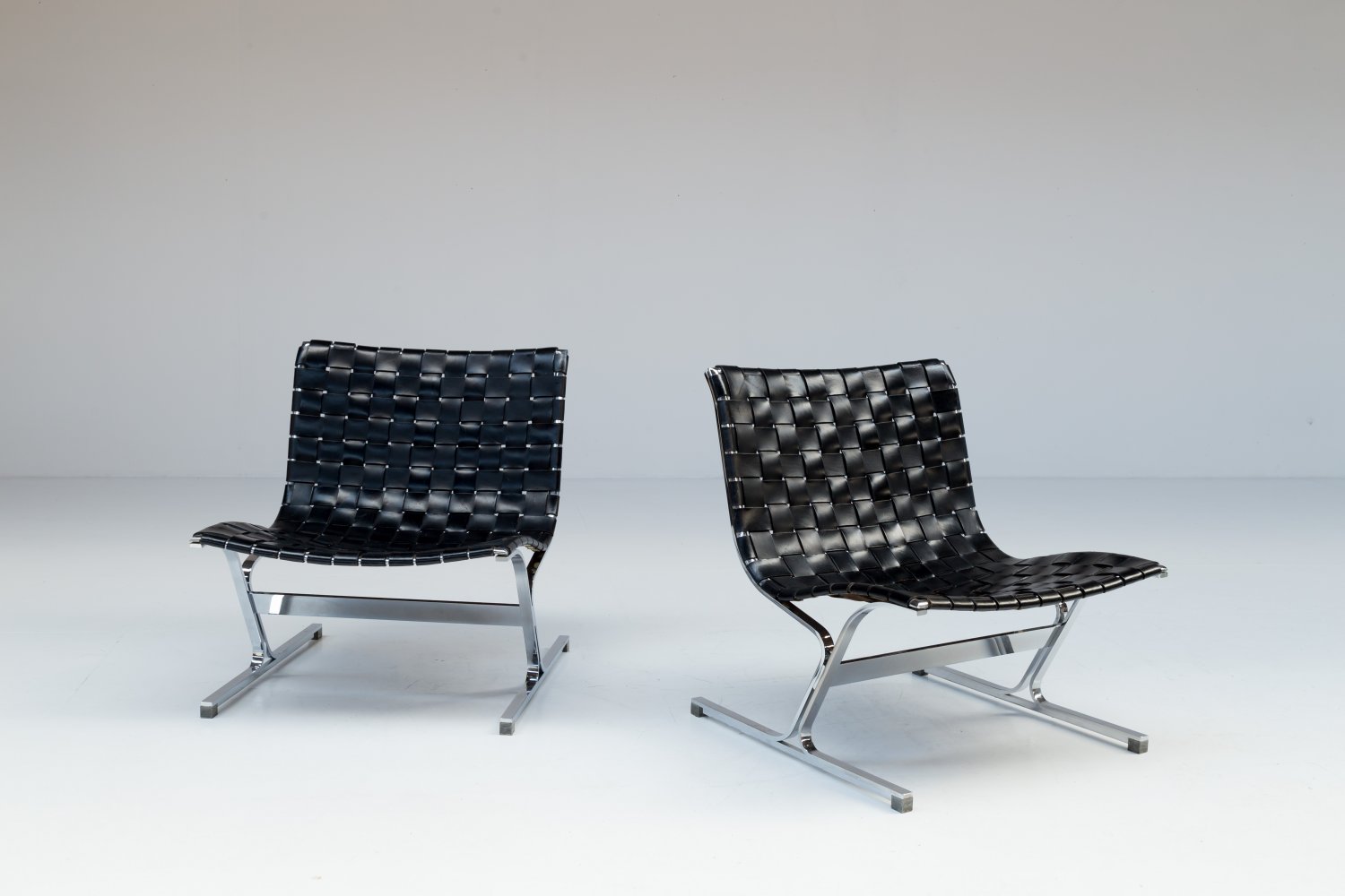 Pair of black leather 'Luar' chairs by Ross Litell 