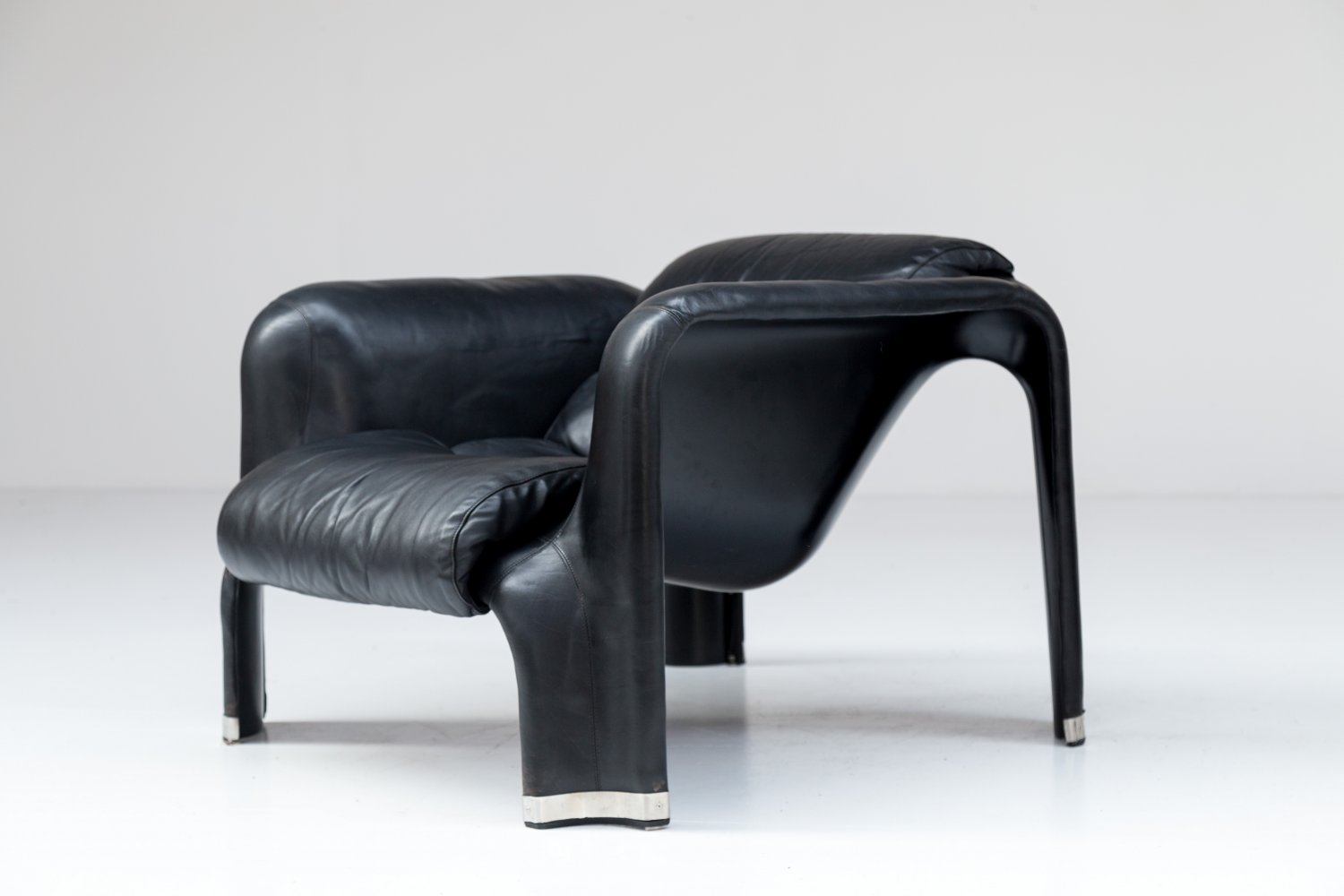 Pair of black leather Pohjola chairs by Pekka Perjo for Haimi Finland.