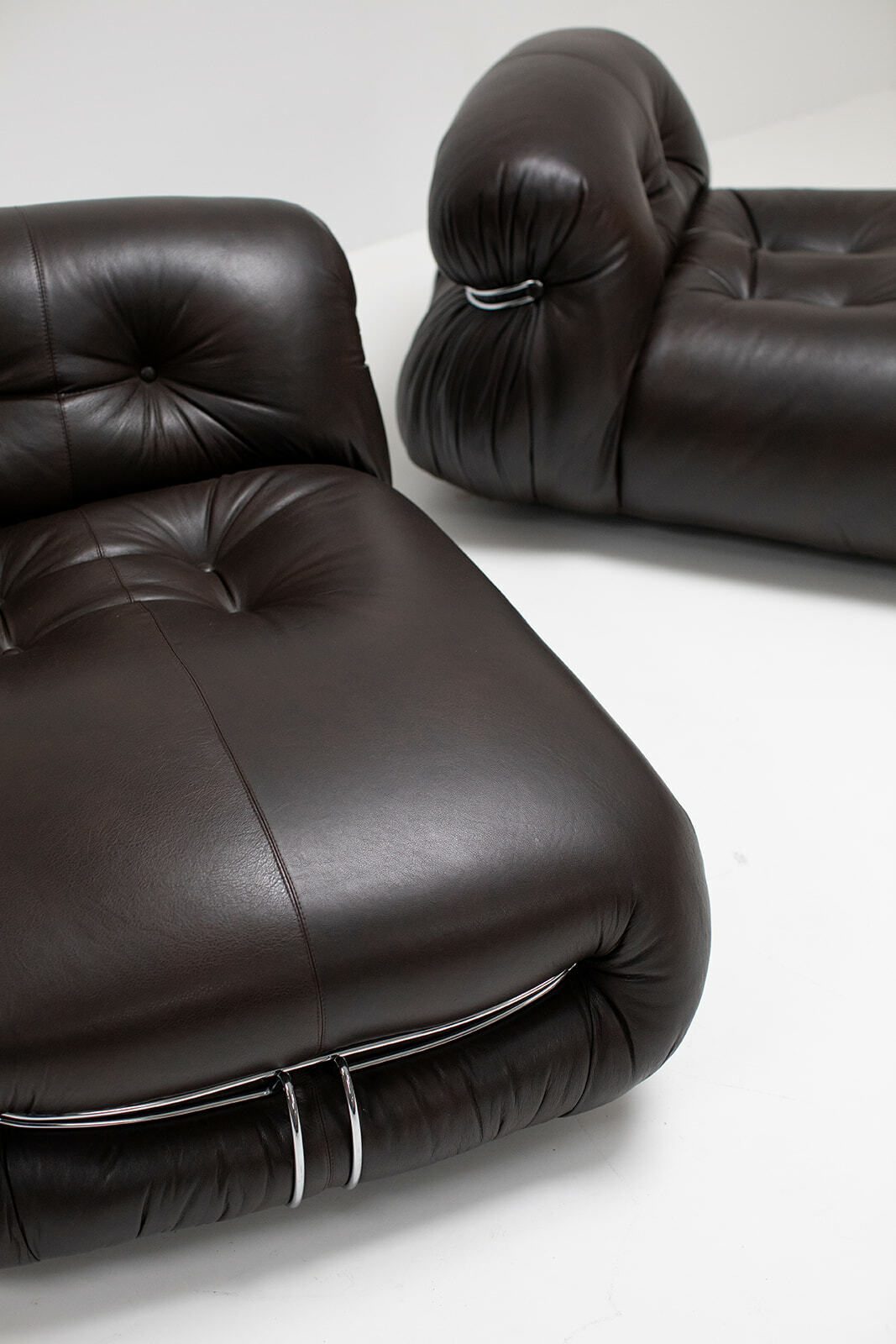 Pair of dark brown leather Soriano lounge chairs