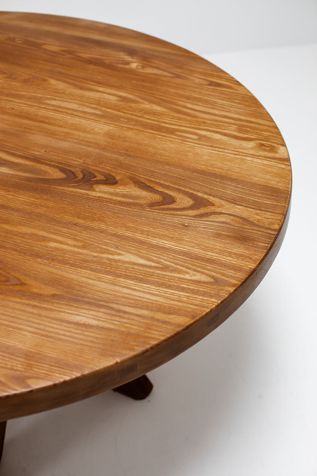 Round dining table by Pierre Chapo