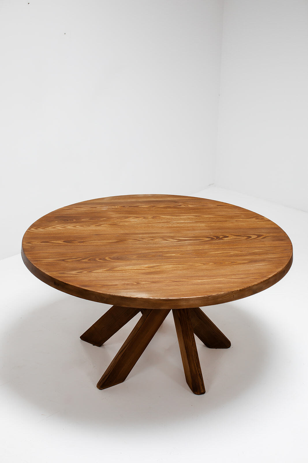 Round dining table by Pierre Chapo